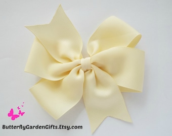 Cream pinwheel hair bow clip