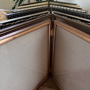 Vintage and antique double metal frames 8x10 hinged bi-fold table-top or wall hanging gold brass metal embossed