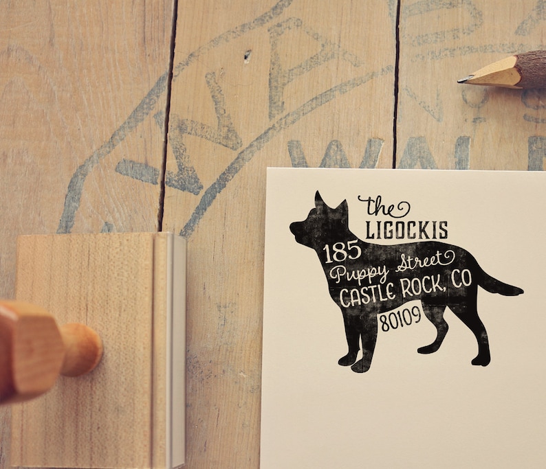May include: A black silhouette of a dog with the text "the LIGOCKIS 185 Puppy Street CASTLE ROCK, CO 80109" printed on it.