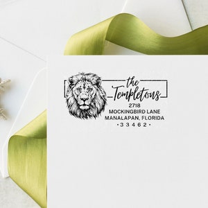 a white envelope with a stamp of a lion