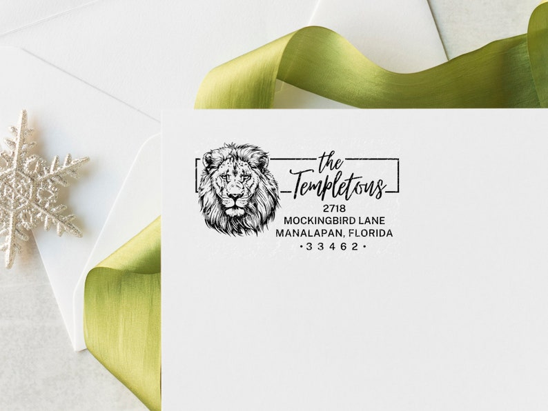 a white envelope with a stamp of a lion