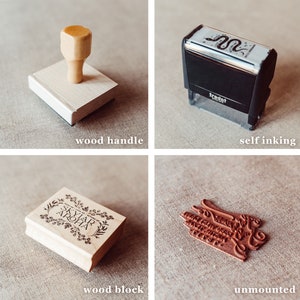 May include: Four different types of rubber stamps. The first is a wooden handle stamp with a blank surface. The second is a self-inking stamp with a snake design. The third is a wooden block stamp with the text "SKYLAR & AROHA" and a floral design. The fourth is an unmounted rubber stamp with a cursive design.