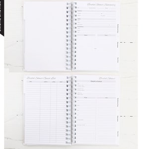 May include: A white spiral-bound bridal shower planner with sections for guest lists, details, and a summary. The planner includes lined pages and tabs for organization. The words "Bridal Shower" are printed on the side.