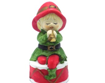 Jasco Bell Musician Blond Boy or Girl Figurine in Red Hat seated on Drum Playing Horn 1970s