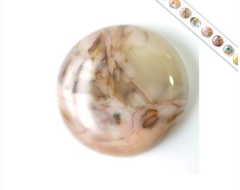 May include: A round, white agate cabochon with brown and gray swirling patterns. The stone has a smooth, polished surface.