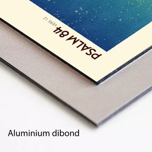May include: A close-up of a white and cream coloured print with the text "PSALM 84" and "VERS 12" in brown text. The print is mounted on a silver aluminium dibond.