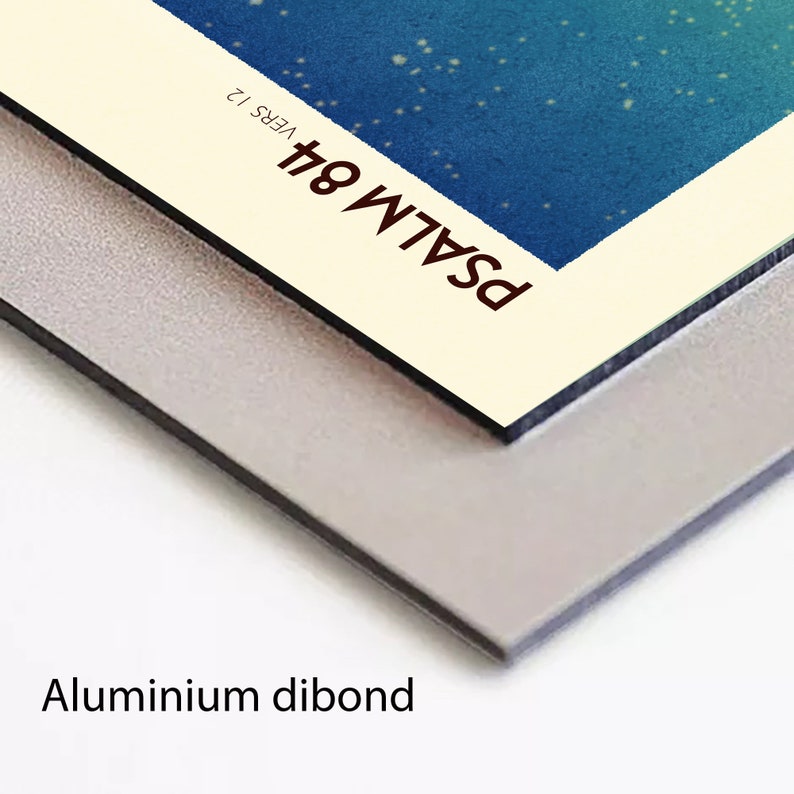 May include: A close-up of a white and cream coloured print with the text "PSALM 84" and "VERS 12" in brown text. The print is mounted on a silver aluminium dibond.