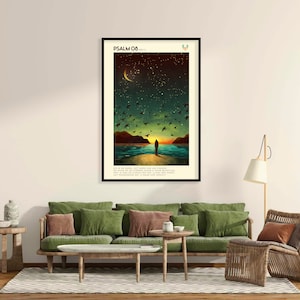May include: A framed print featuring a colourful illustration of a person standing on a beach at sunset. The sky is filled with stars and a crescent moon. The print includes the text "PSALM 08..." and a verse from the Bible.