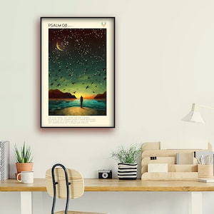 May include: A framed print featuring a dark blue background with a silhouette of a person standing on a beach, gazing out at the ocean. The sky is filled with stars and a crescent moon. The print includes the text "PSALM 08" at the top and a verse from the Bible beneath the image.