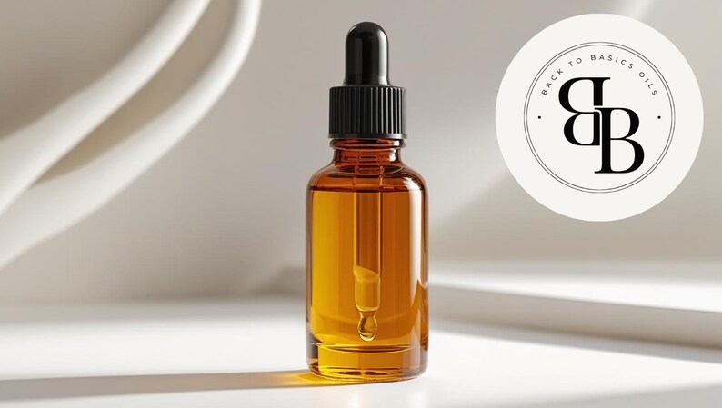 May include: Amber glass bottle with a black dropper filled with a golden liquid. The bottle is labeled with the text "BACK TO BASICS OILS" in a circular logo. The background is a minimalist white design.