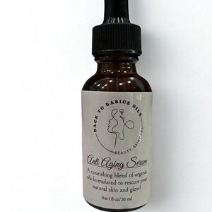 May include: A brown glass bottle of Anti Aging Serum with a black dropper. The label reads "Back to Basics Oils" and "Beauty Skincare." The text "Anti Aging Serum" is displayed prominently. The bottle contains 1 fl oz / 30 ml.