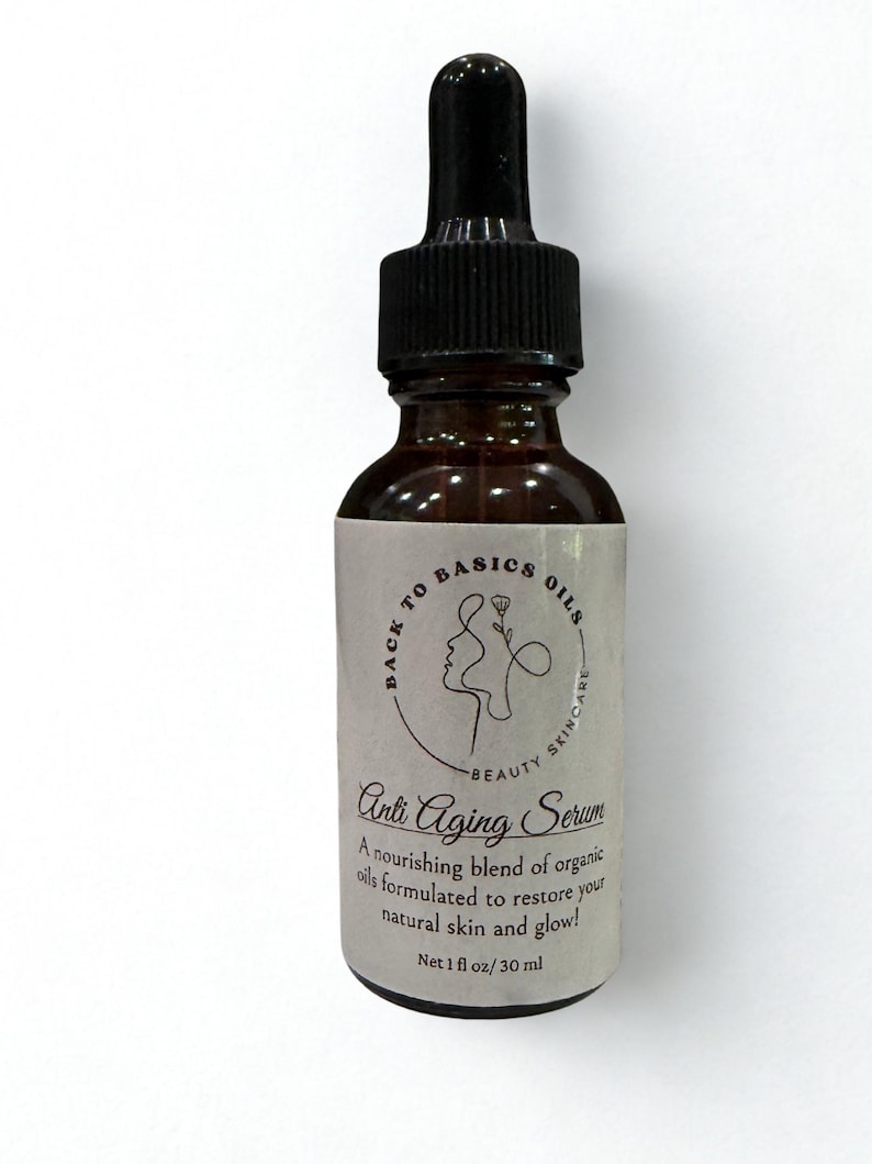 May include: A brown glass bottle of Anti Aging Serum with a black dropper. The label reads "Back to Basics Oils" and "Beauty Skincare." The text "Anti Aging Serum" is displayed prominently. The bottle contains 1 fl oz / 30 ml.