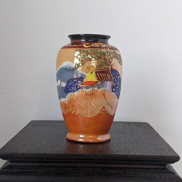 Satsuma style vase, everything is happening around this little vase--a willow tree, mountains, a lake & a meadow--honey, luster, orange...