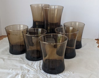 Seven sturdy, Danish / Mid Century vibed tumblers or rocks glasses in a nice cool toned brown, similar to 'tawny' colored. Great size!