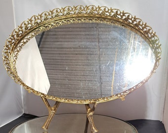 Seventeen inch wide gold toned, footed, galleried mirror tray surrounded by sweet swirls of primroses - Mid Century Modern, Regency, Chic