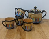 A Thousand Faces pattern, four tea cups and a sugar w lid, fabulous hand painting, gilt featuring faces, patterns gold gilt fantastic