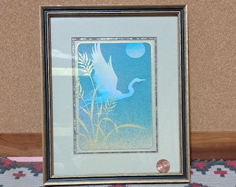 Such a pretty multi-level print featuring a crane or heron in sky and turquoise blues with a sandy underlay and gold overlay of marsh grass