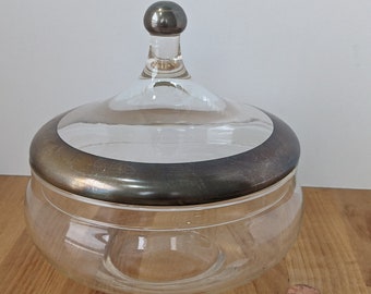Classy, fine glass covered dish with platinum or silver detailing on the lid, very elegant and useful.