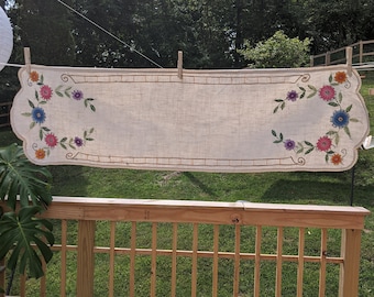 Heavily woven cotton linen with crocheted lace edging and spectacular embroidery...so three dimensional in colors that glow...it&#39;s a beauty.