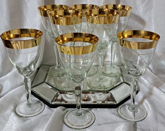 Two sets of four goblets (each set sold separately) very elegant hand blown and 24 K gold painted, tall wine or champagne glasses--so chic