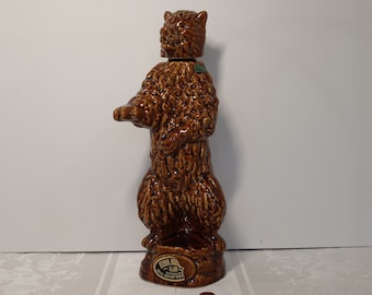 Big, shaggy, brown bear decanter--great for sculptural effect alone--dated 1968. Has original liquor tax stamp and a partial label.