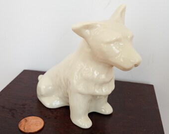 Tender little Beleek porcelain dog. He has such stern look & an endearing tipped ear, fantastic detail. Described as Scottie or Irish Corman