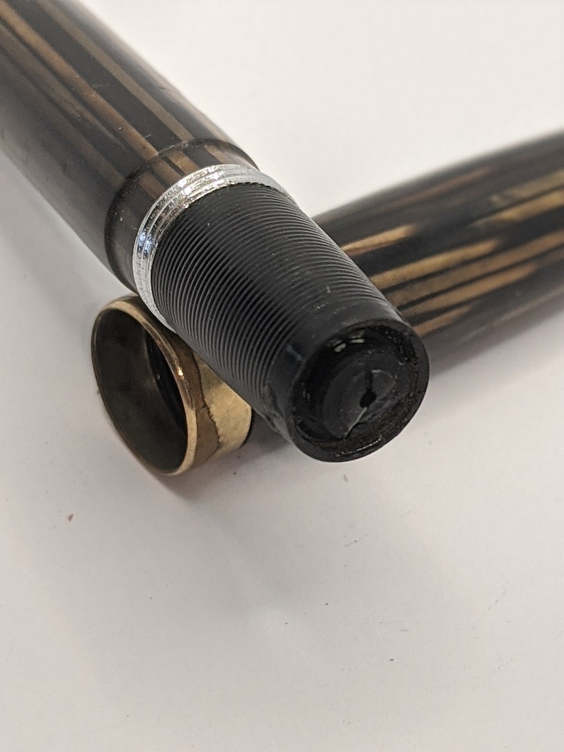 beautiful pen referred to as the Peacemaker in planked and opalecent shades of brown and amber. 1935 Sheaffer 1000 Fountain Pen