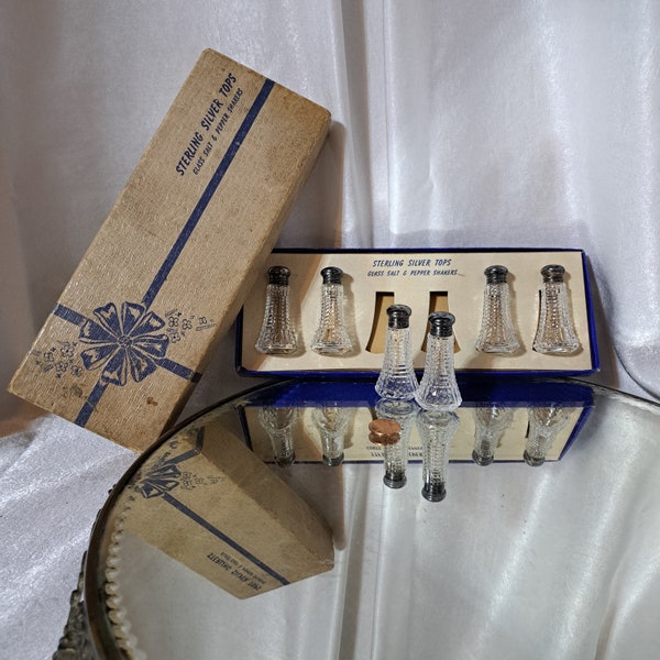 Boxed set of 1950s glass salt & pepper shakers with sterling silver tops...perfect for your table setting on special...or why not...everyday