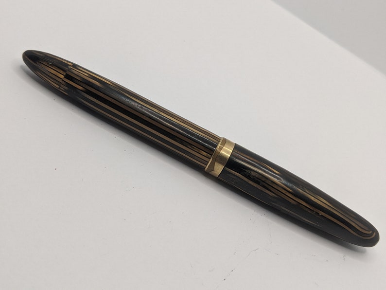 beautiful pen referred to as the Peacemaker in planked and opalecent shades of brown and amber. 1935 Sheaffer 1000 Fountain Pen