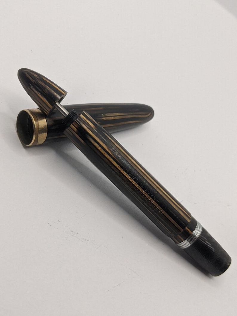 beautiful pen referred to as the Peacemaker in planked and opalecent shades of brown and amber. 1935 Sheaffer 1000 Fountain Pen