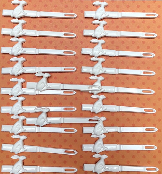 20 white straight barrettes with teeth. Gem