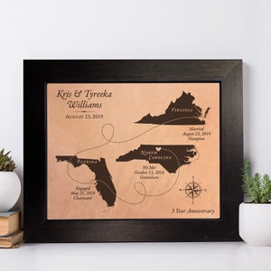 This leather 3rd or 9th anniversary gift showcases travel between 3 states. Made to order, this personalized leather keepsake map shows the couples love story unfold. Each leather map is unique as the individuals in love. Framed and ready to hang.