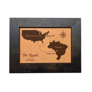 Long distance love journey map between two countries. This custom leather love map shows the distance traveled to meet and be together between the United States and Brazil. Engraved on leather for a leather anniversary and framed and ready to hang