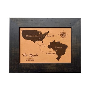 Long distance love journey map between two countries. This custom leather love map shows the distance traveled to meet and be together between the United States and Brazil. Engraved on leather for a 3rd anniversary and framed and ready to gift.