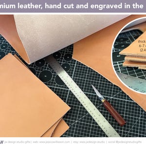 A stack of multiple pieces of 6-7 oz (2.4-2.8 mm) thick, vegetable tanned leather showing the hand cutting process from the full leather hide. The leather is from the USA and is hand cut and engraved by JW Design Studio Gifts.  Multiple leather art sizes are available, with unframed or framed options.