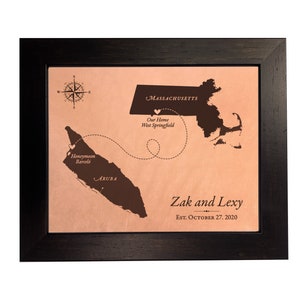 A leather anniversary gift and keepsake. Unique leather map art that shows the  honeymoon destination and wedding location. Each map is custom and personalized per your order requests. This sample design shows the travel between wedding venue location and honeymoon in Aruba. Personalized with names and wedding date and engraved on real leather.