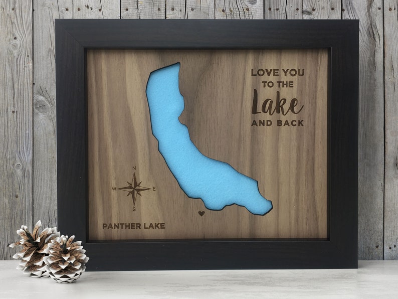 May include: A framed wooden map of Panther Lake with a blue lake cutout and the text "Love you to the Lake and back".