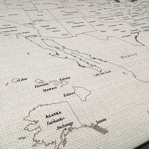 Framed 100% cotton USA travel map in its natural state, designed for pinning travels or DIY watercolor painting. A thoughtful cotton anniversary gift or custom travel tracker adventure map.