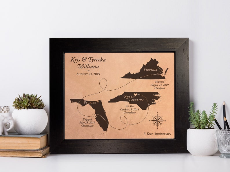 This leather 3rd or 9th anniversary gift showcases travel between 3 states. Made to order, this personalized leather keepsake map shows the couples love story unfold. Each leather map is unique as the individuals in love. Framed and ready to hang.