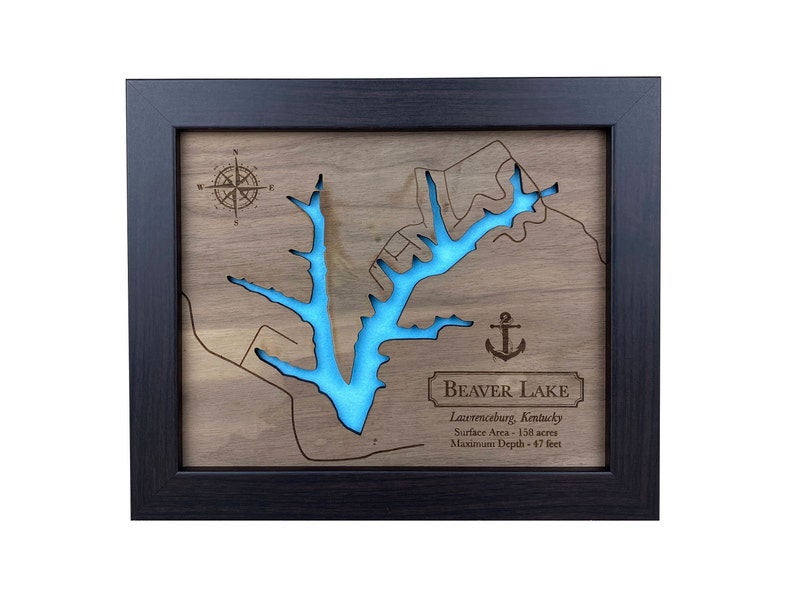 May include: A framed wooden map of Beaver Lake in Lawrenceburg, Kentucky. The lake is outlined in blue and the map includes a compass rose and an anchor. The text "Beaver Lake" is printed in a banner at the bottom of the map, along with the lake's surface area and maximum depth.