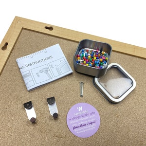 cork board travel map by JW Design Studio Gifts comes with easy hanging hardware and instructions. Plus your choice of 100 map pins in a tin.