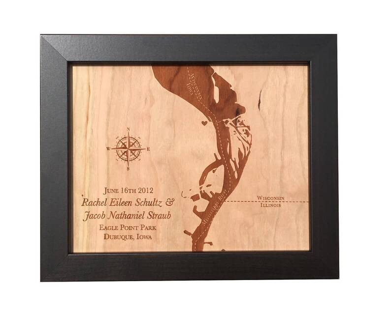 May include: A framed wooden map of Eagle Point Park in Dubuque, Iowa, with the text "June 16th 2012 Rachel Eileen Schultz & Jacob Nathaniel Straub Eagle Point Park Dubuque, Iowa" and "Wisconsin Illinois" engraved on the wood.