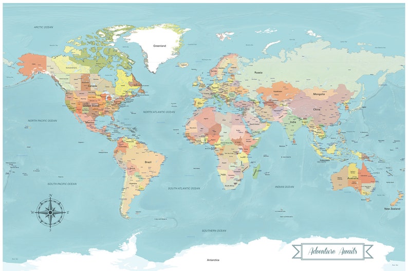 Full size image of the blue colorful world push pin map. It has a custom banner detail, this one states Adventure Awaits. The countries are multi colored and very colorful, the water is a teal pastel blue. There is a compass on the world map