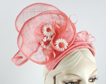 Womens fun and funky asymmetrical peach coral fascinator hat for Kentucky Derby, ladies tea, special events