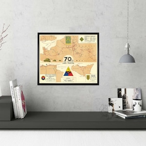 May include: A framed map showing the combat operations of the 70th Tank Battalion during World War II. The map shows the battalion's movements in Europe, including the North African Campaign, the Sicilian Campaign, and the Italian Campaign. The map is in a black frame and has a white background.