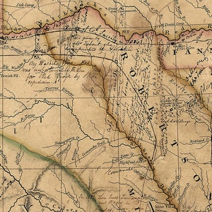 May include: A detailed, antique map with handwritten annotations and geographical features. The map features rivers, trails, and place names, including "Comanche Trail" and "Red River." The color palette is muted, with shades of tan, brown, and faded red.