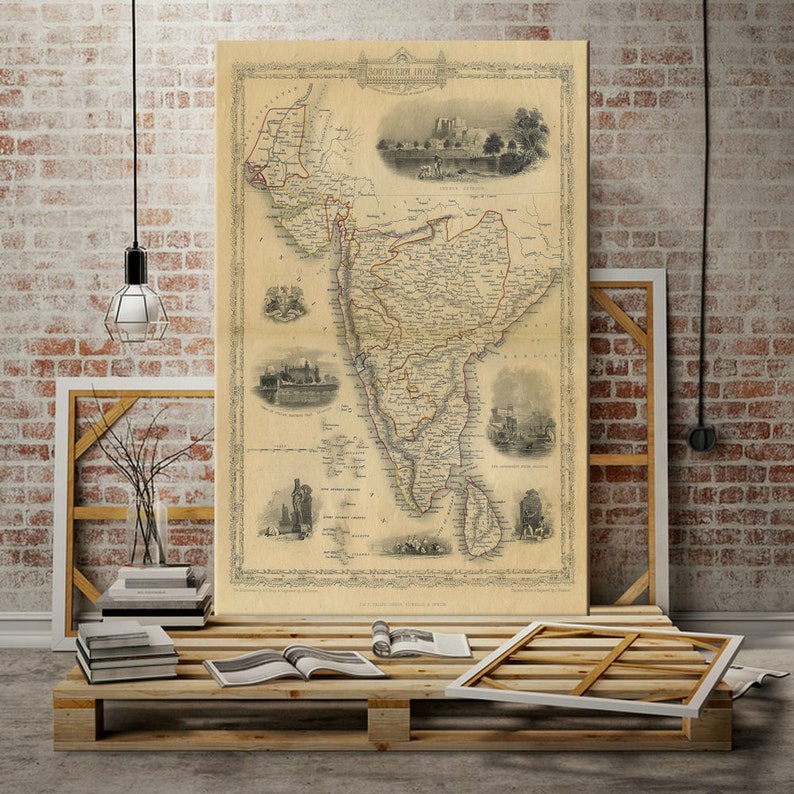 May include: An antique map of Southern India, printed in black and white with red accents. The map shows the different regions of Southern India, including the cities of Madras, Bangalore, and Hyderabad. The map is surrounded by a decorative border and includes several inset maps and illustrations.
