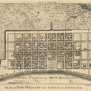 May include: A black and white map of New Orleans, Louisiana, showing the city's layout and streets. The map is titled "Plan of New Orleans the Capital of Louisiana." and includes the text "River St. Louis or Mississippi."