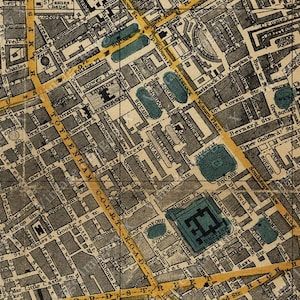 May include: An antique map of London, England, with detailed street names and landmarks. The map is printed in black and white with yellow and blue accents. The map shows the area around Covent Garden and includes the names of streets like "Great Queen Street", "Long Acre", and "Southampton Street".