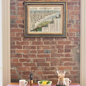 May include: A wooden table with a colorful striped runner. On the table are two mugs, a pepper grinder, a glass carafe with a brown filter, and a bowl of limes.